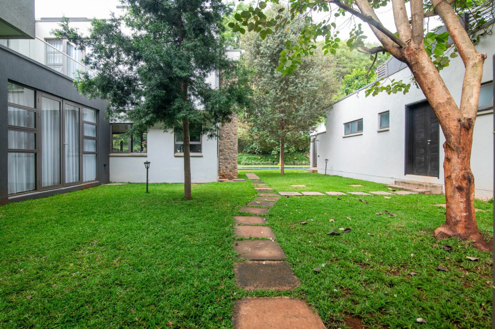 Private swimming pool and landscaped garden at luxury Karen residence