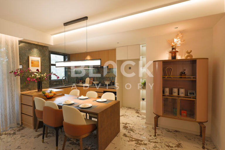 Amani Residence show apartment open-plan kitchen with a table for six and a display cabinet