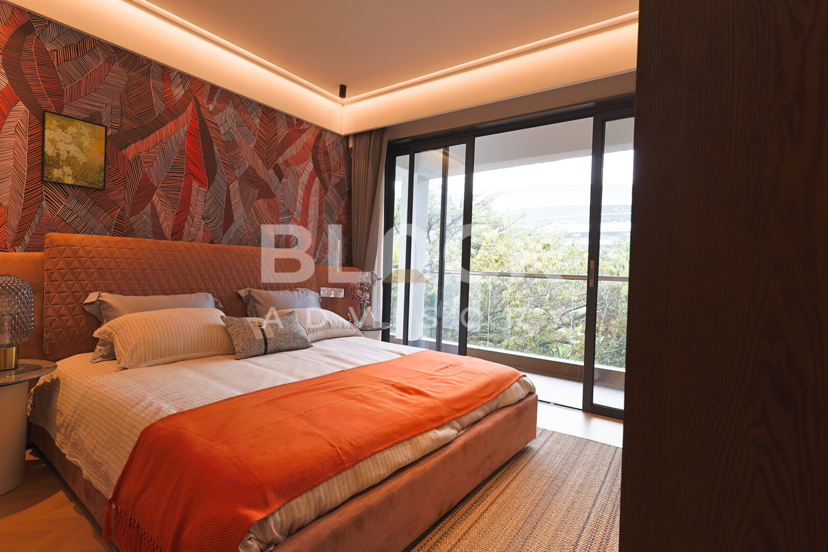 Amani Residence show apartment main bedroom with sliding doors to the balcony