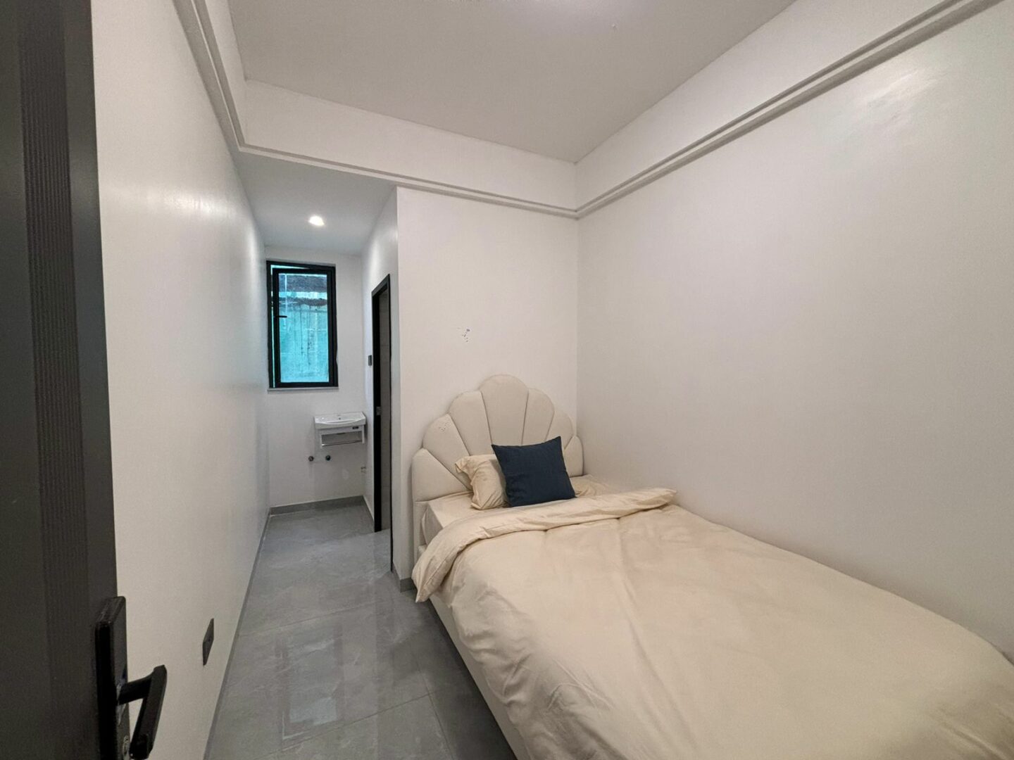 Bahari Homes Spacious bedroom with built-in wardrobes.