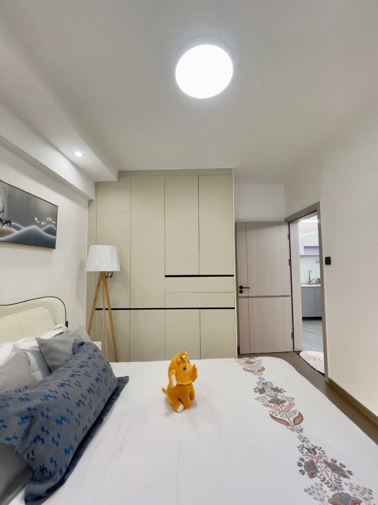 Serene Manor show apartment bedroom with a double bed and built-in storage