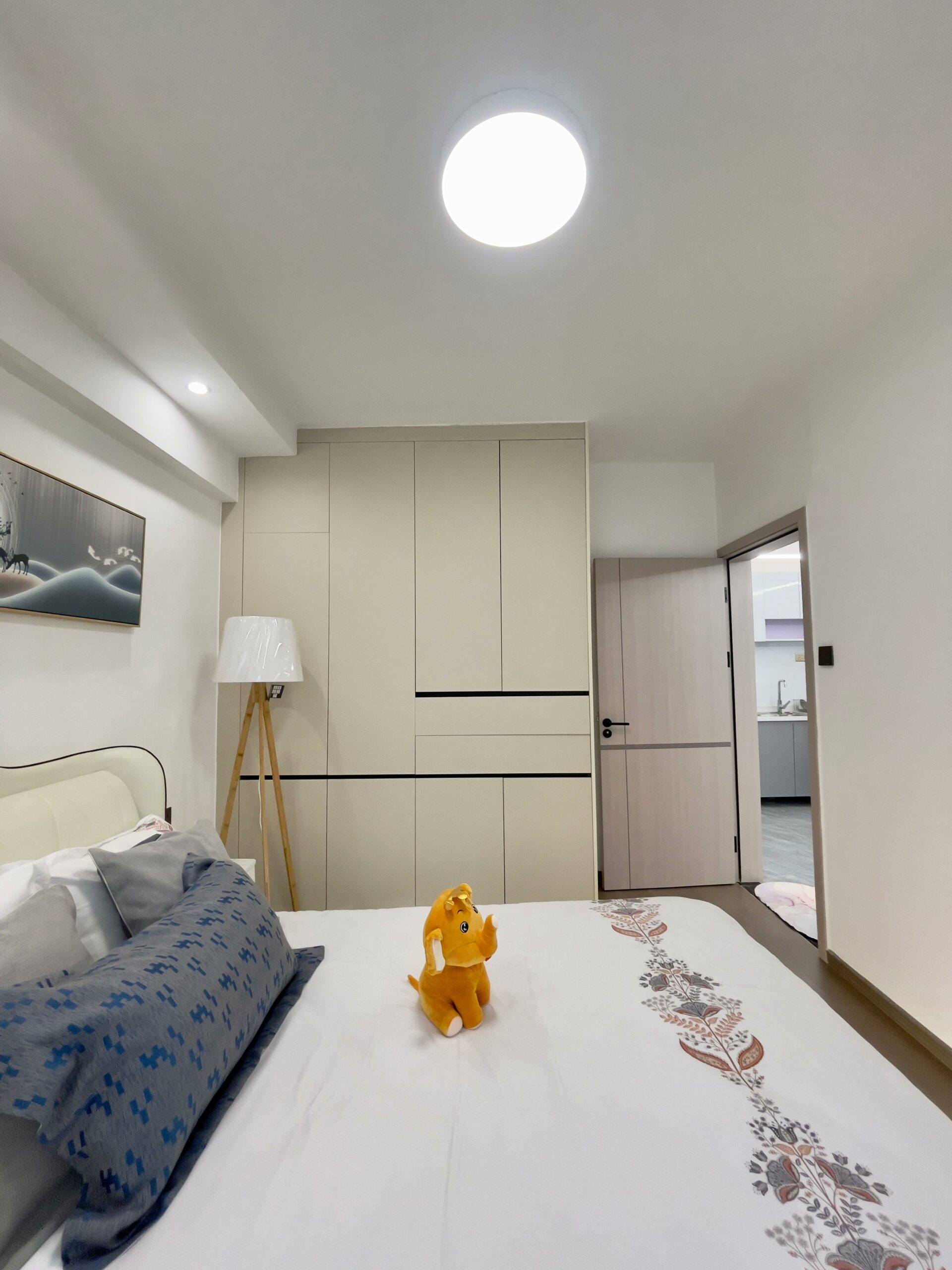 Serene Manor show apartment bedroom with a double bed and built-in storage