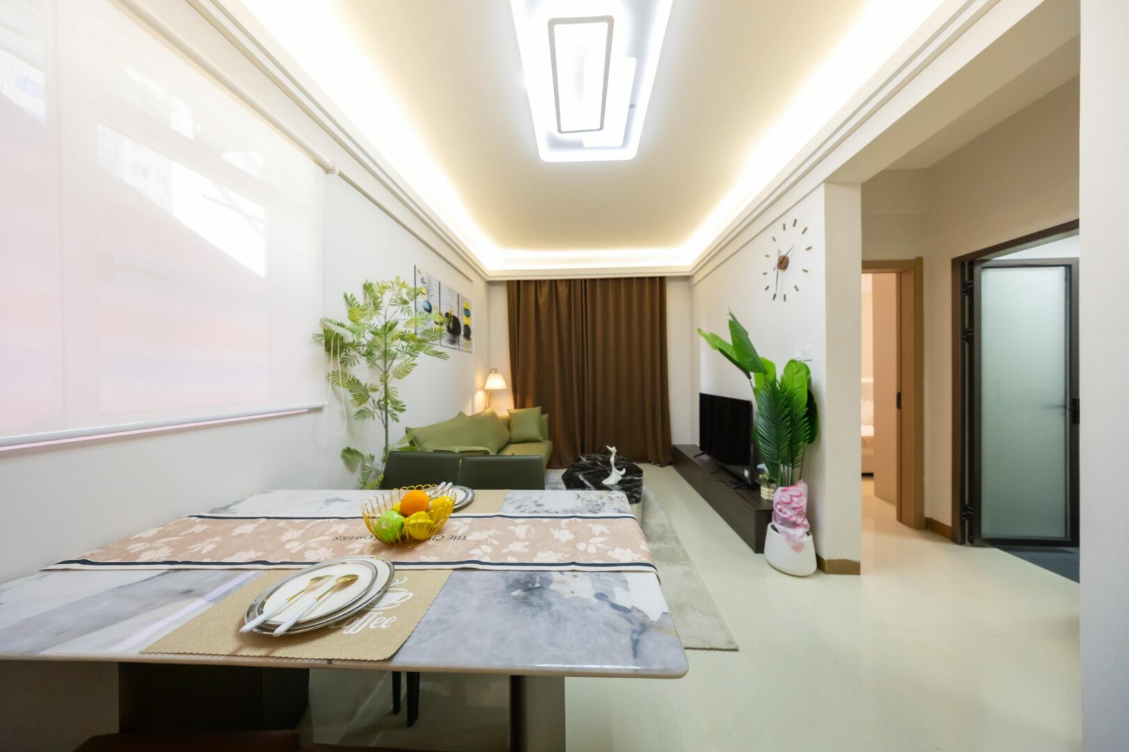 Spacious sitting area with large windows for natural light.