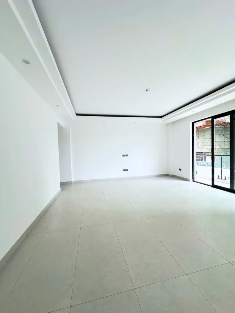 Urban Dream Spacious sitting area with large windows for natural light.