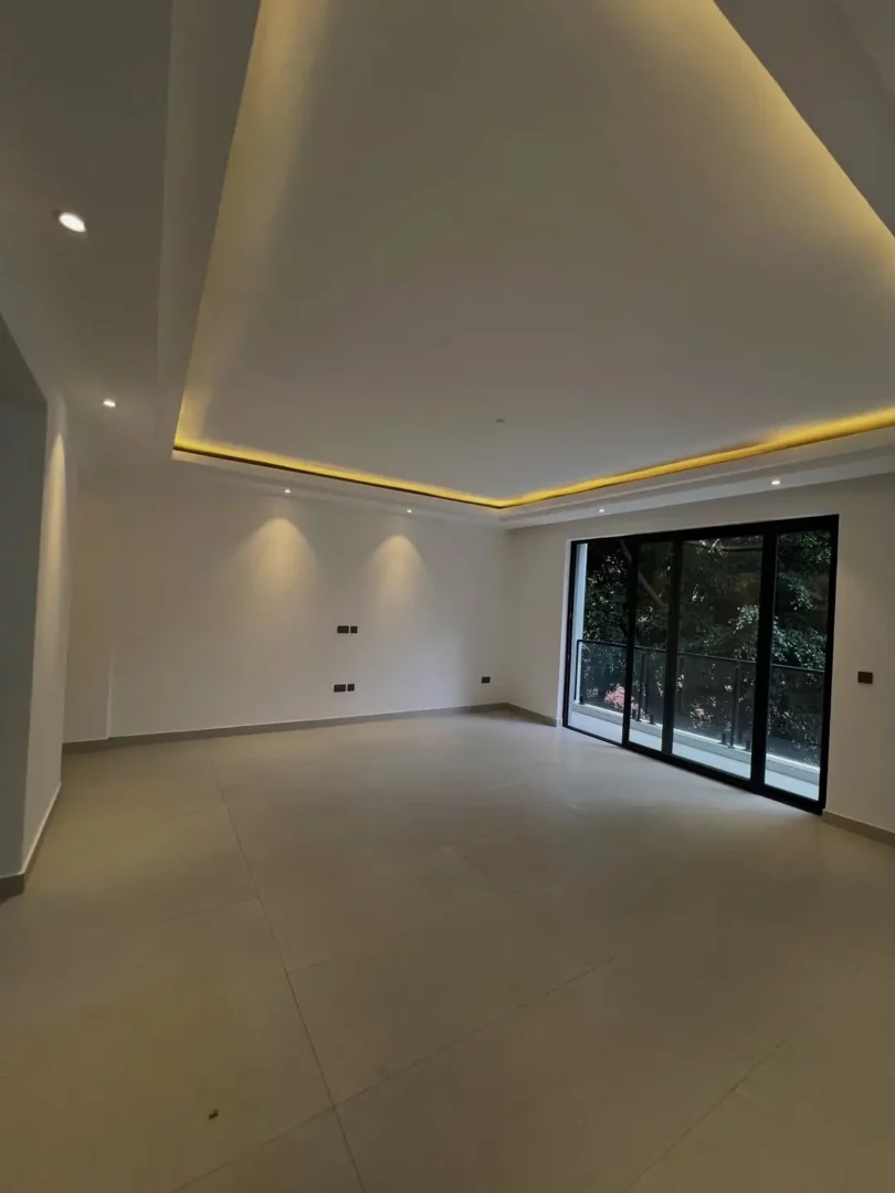 Urban Dream Spacious sitting area with large windows for natural light.