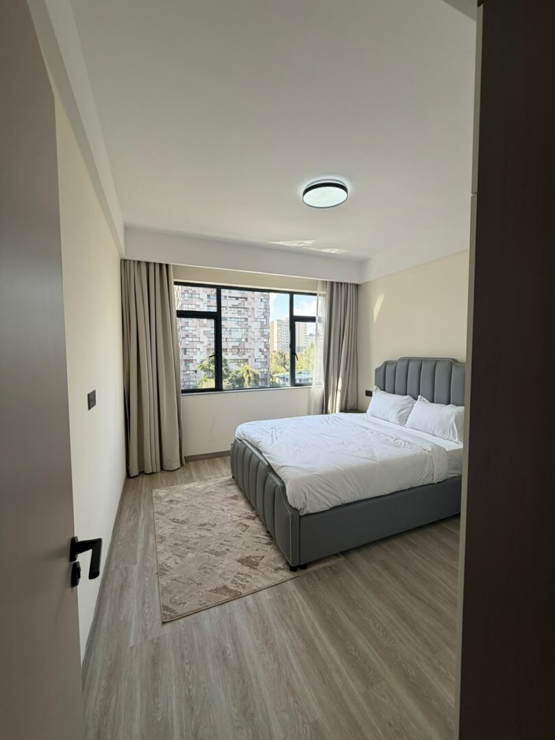 Bahari Homes Spacious bedroom with built-in wardrobes.