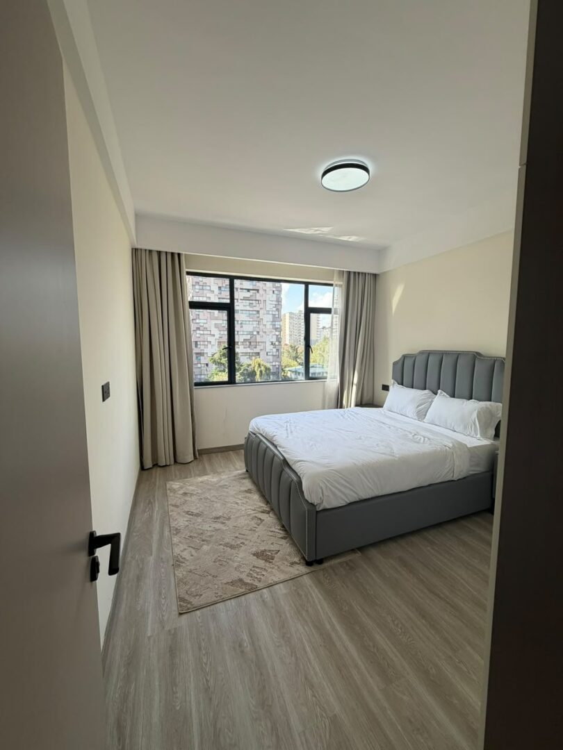 Bahari Homes Spacious bedroom with built-in wardrobes.