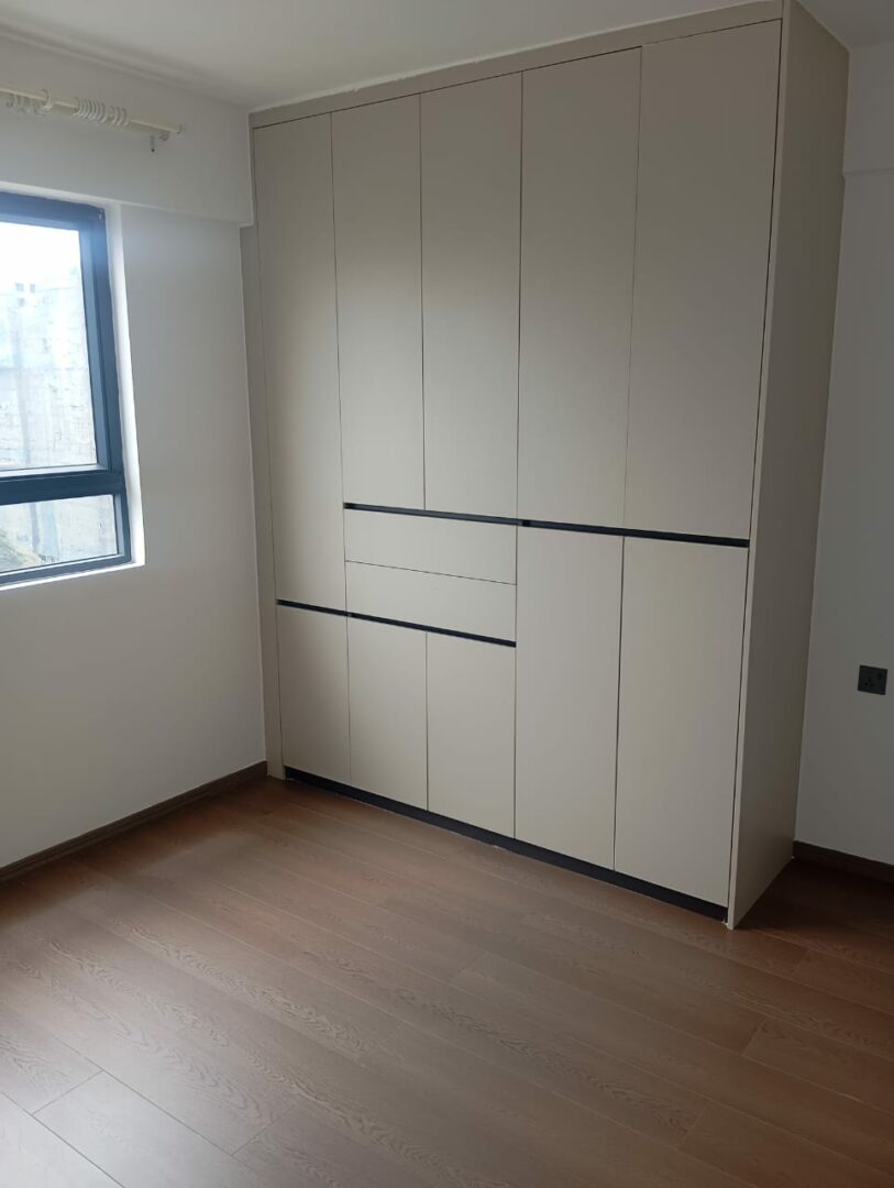 Serenity Residence Spacious bedroom with built-in wardrobes.