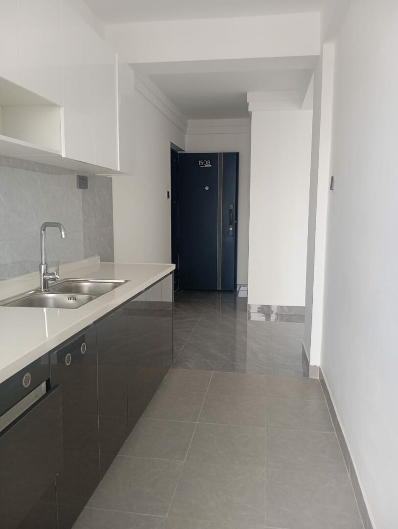 Serenity Residency Modern fitted kitchen with sleek, functional finishes.