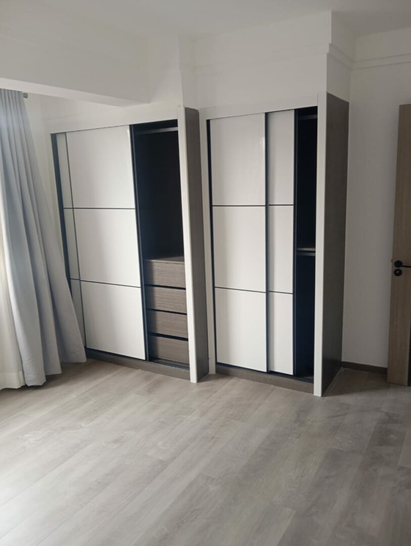 Polaris Residency Spacious bedroom with built-in wardrobes.