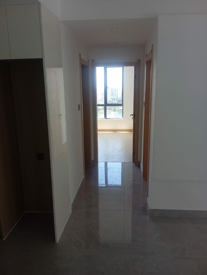 Riara One Spacious bedroom with built-in wardrobes.