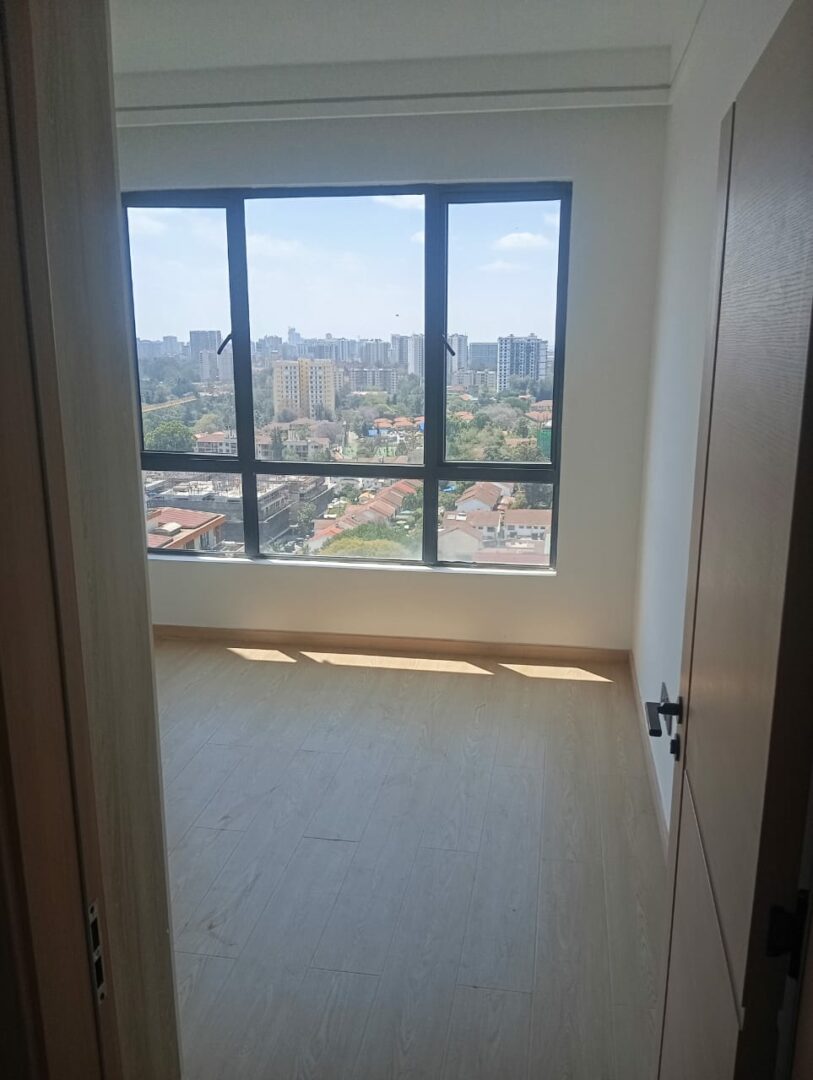 Riara One Spacious bedroom with built-in wardrobes.