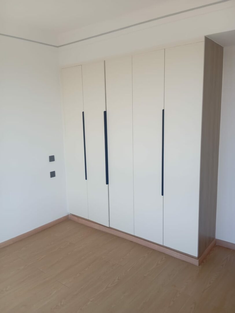 Riara one Spacious bedroom with built-in wardrobes..