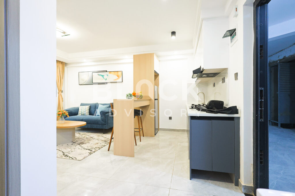 City Oasis Homes show apartment: living room with breakfast bar
