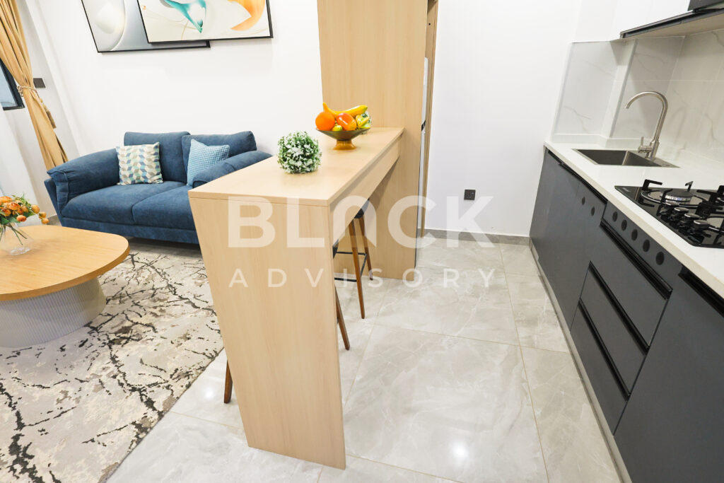 City Oasis Homes show apartment: living room and kitchen counter